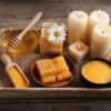 Body scrub and honey on wooden background